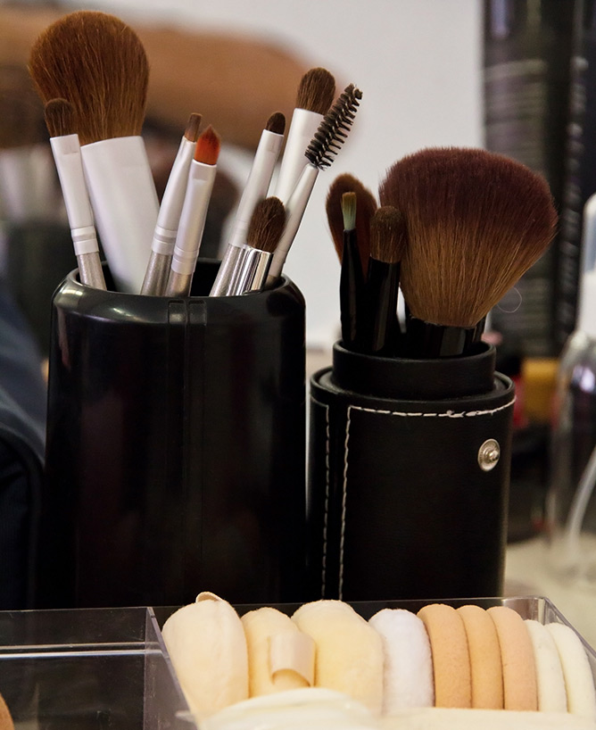 A collection of makeup brushes and sponges used at The Iver Academy