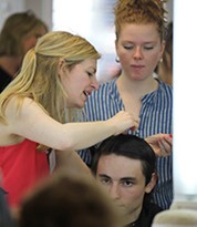 Iver Academy Tutor explaining hair-cut techniques during Barbering training course