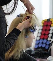 Hair artist applying character hair during a training course at Iver Academy